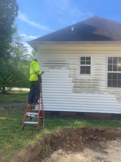 Power washing exterior vinyl siding